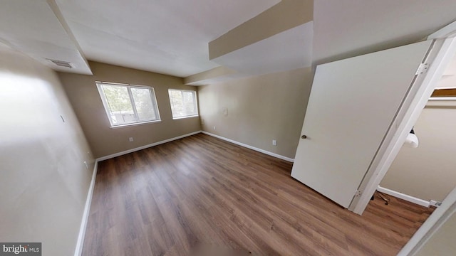 10239 Prince Pl Unit 26-T1, Upper Marlboro, MD 20774 - spare room featuring wood finished floors and baseboards
