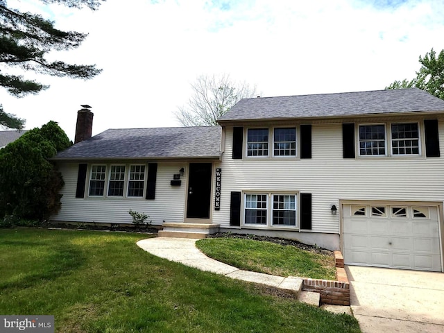 178 Forge Rd, Delran, NJ 08075 - tri-level home with an attached garage, a chimney, a front lawn, and driveway