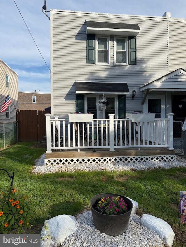 rear view of house featuring a deck