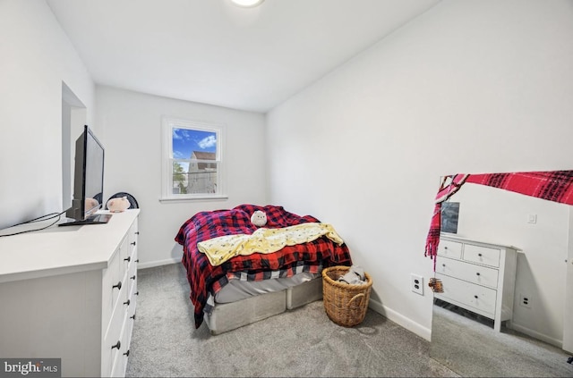 carpeted bedroom with baseboards