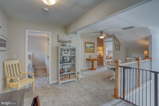 corridor with an upstairs landing, carpet, and baseboards