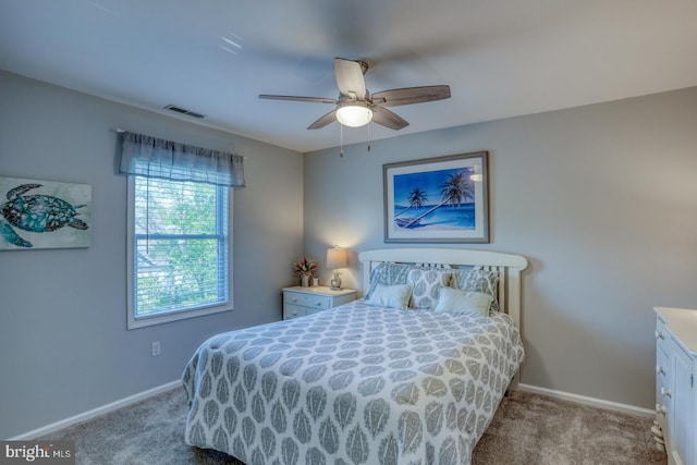 carpeted bedroom with baseboards and ceiling fan