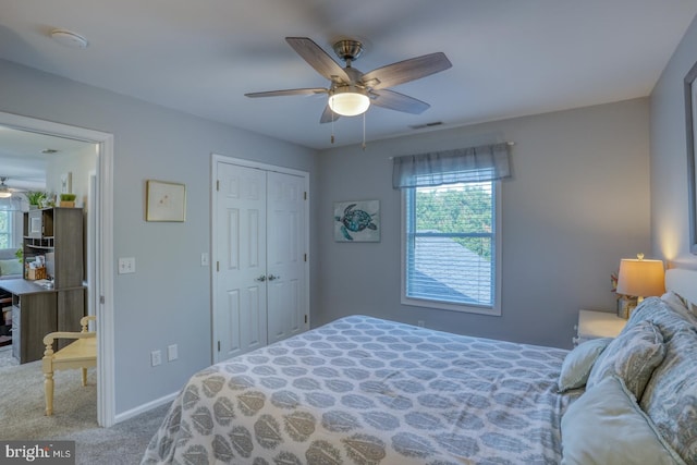 bedroom featuring multiple windows, carpet flooring, a closet, and a ceiling fan