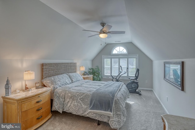 carpeted bedroom with vaulted ceiling, a ceiling fan, and baseboards
