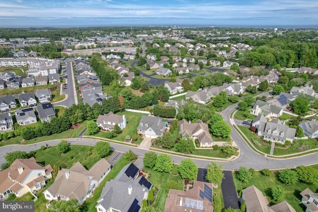 aerial view of property's location with nearby suburban area
