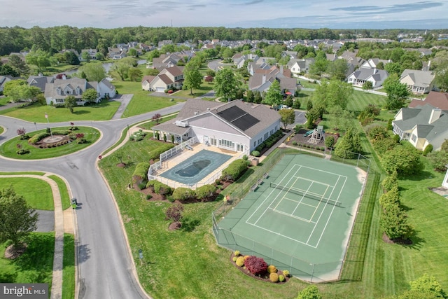 aerial perspective of suburban area featuring a pool area