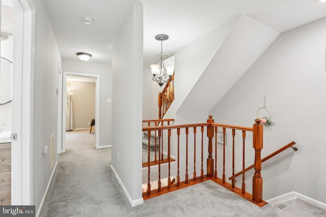 41 Fair Acres Ct, Princeton, NJ 08540 - corridor featuring an upstairs landing, carpet flooring, a chandelier, and baseboards