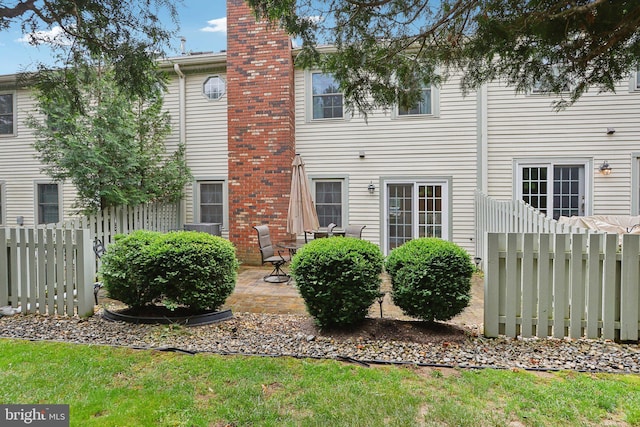 41 Fair Acres Ct, Princeton, NJ 08540 - rear view of property with a chimney, fence, and a patio