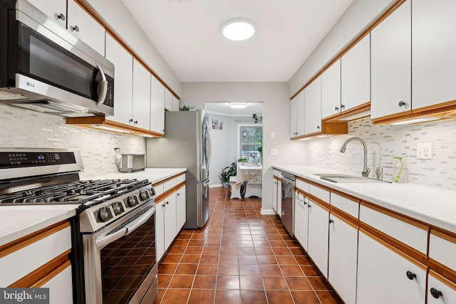 41 Fair Acres Ct, Princeton, NJ 08540 - kitchen with appliances with stainless steel finishes, a sink, white cabinets, and light countertops