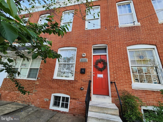 view of front of home with brick siding