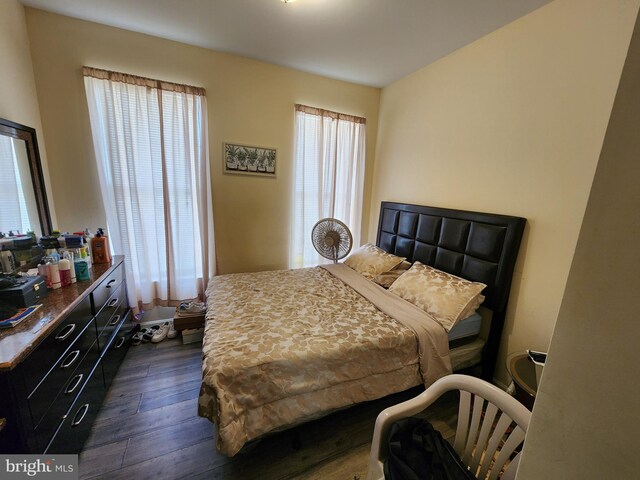 bedroom featuring dark wood-style flooring