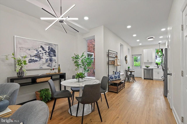 dining area featuring light wood-style floors and recessed lighting