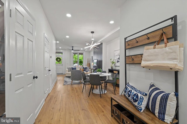 hall with light wood-style floors and recessed lighting