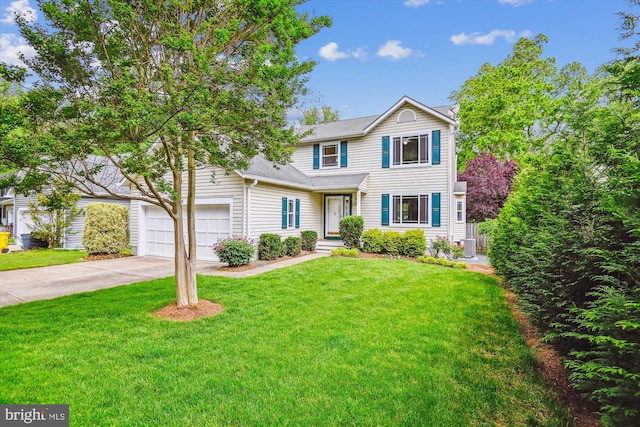 traditional home with concrete driveway, a garage, a front lawn, and central AC