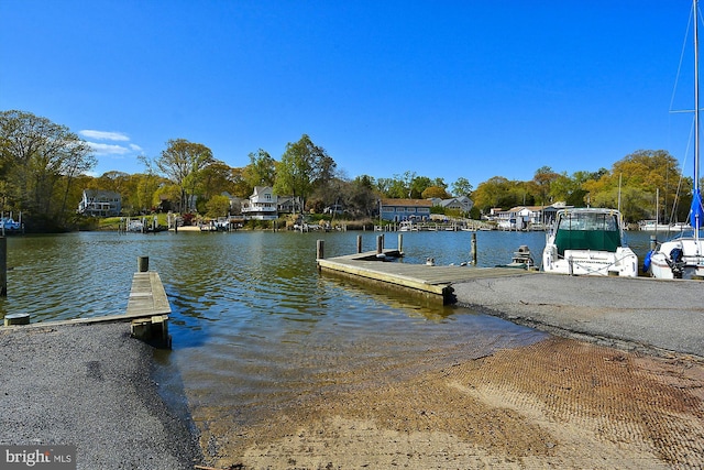 dock area featuring a boat ramp and a water view