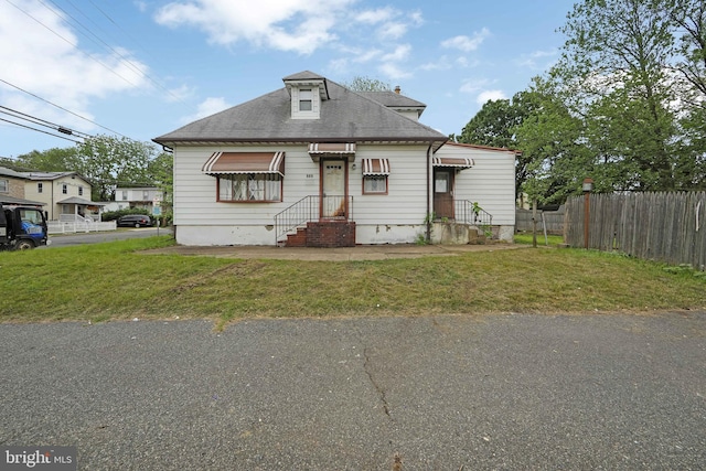 view of front of property featuring roof with shingles