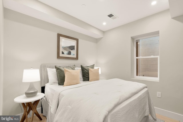 bedroom with baseboards, recessed lighting, and wood finished floors
