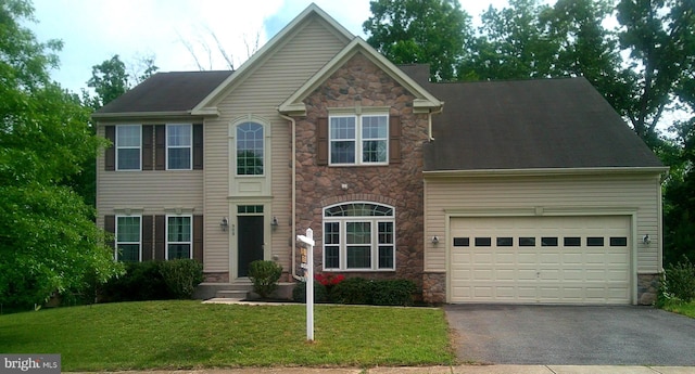 908 Gladway Rd, Baltimore, MD 21220 - view of front of property featuring stone siding, asphalt driveway, a front lawn, and a garage