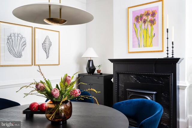 dining space with a fireplace