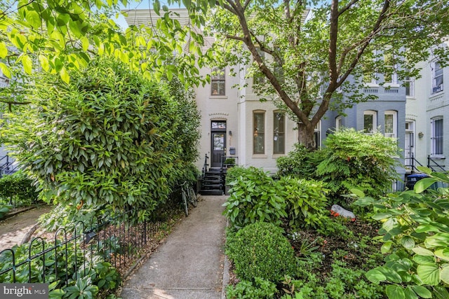 doorway to property featuring brick siding