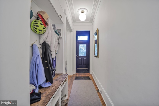 mudroom with wood finished floors and crown molding