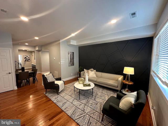 3133 Richmond St, Philadelphia, PA 19134 - living room with hardwood / wood-style flooring, baseboards, recessed lighting, and an accent wall