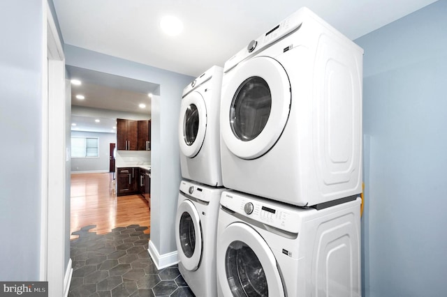 3133 Richmond St, Philadelphia, PA 19134 - laundry room featuring stacked washer / drying machine, recessed lighting, and baseboards