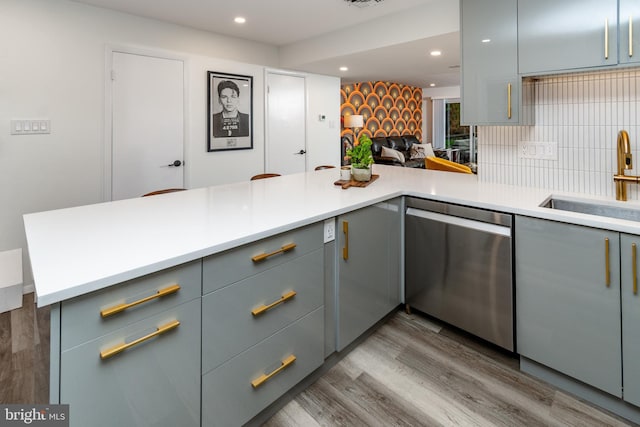 23 Eden Roc, New Hope, PA 18938 - kitchen with dishwasher, gray cabinetry, a sink, light countertops, and wood finished floors