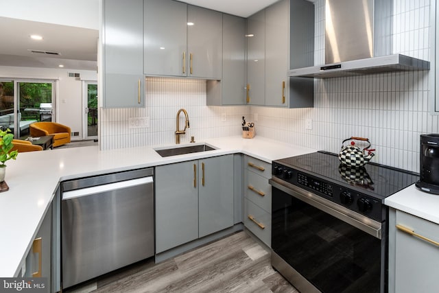 23 Eden Roc, New Hope, PA 18938 - kitchen featuring gray cabinets, stainless steel dishwasher, wall chimney range hood, electric stove, and a sink