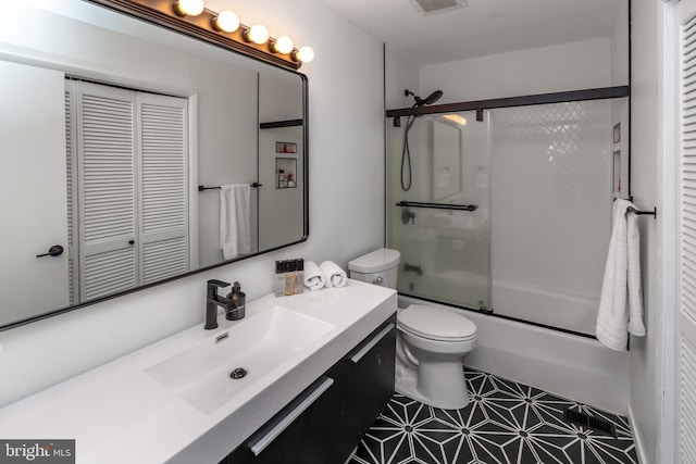 23 Eden Roc, New Hope, PA 18938 - bathroom with a closet, toilet, vanity, combined bath / shower with glass door, and tile patterned floors