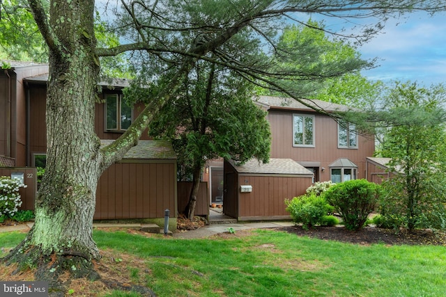 23 Eden Roc, New Hope, PA 18938 - rear view of property with a lawn and roof with shingles