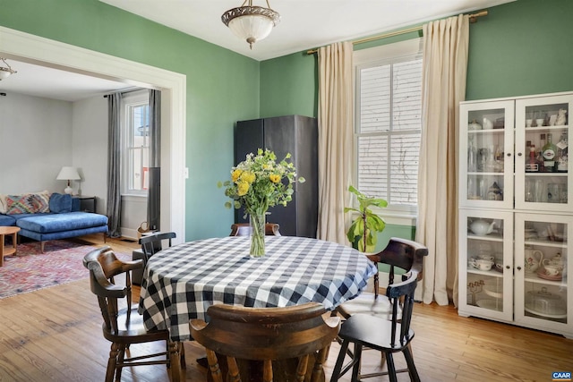 dining space with light wood-type flooring