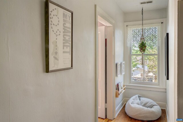 interior space featuring baseboards and light wood-style flooring
