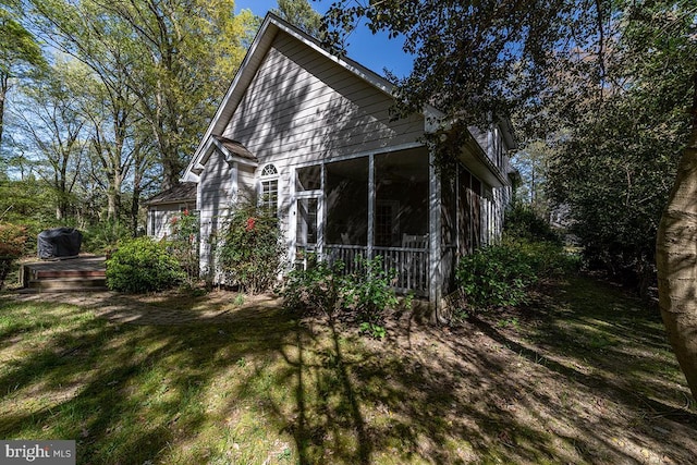 14535 Honeysuckle, Issue, MD 20645 - view of property exterior with a sunroom, a wooden deck, and a yard