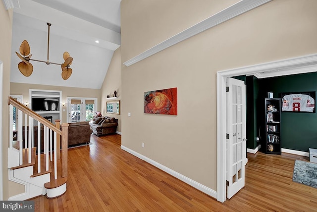 14535 Honeysuckle, Issue, MD 20645 - entryway with light wood-style flooring, baseboards, high vaulted ceiling, and stairway