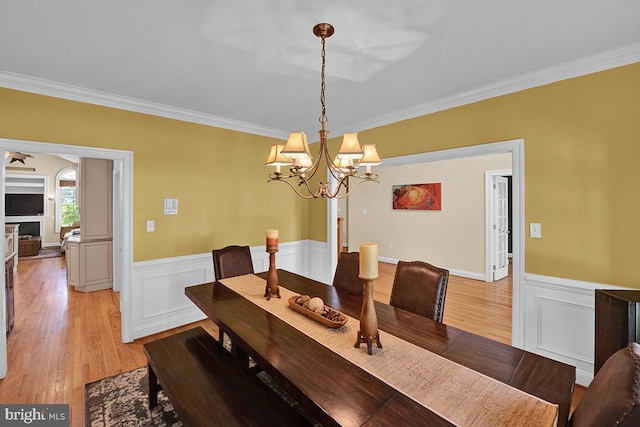 14535 Honeysuckle, Issue, MD 20645 - dining room with ornamental molding, wainscoting, a chandelier, and light wood finished floors