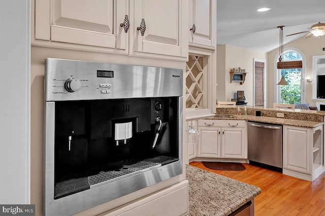 14535 Honeysuckle, Issue, MD 20645 - kitchen featuring appliances with stainless steel finishes, a peninsula, light wood-style flooring, and white cabinetry