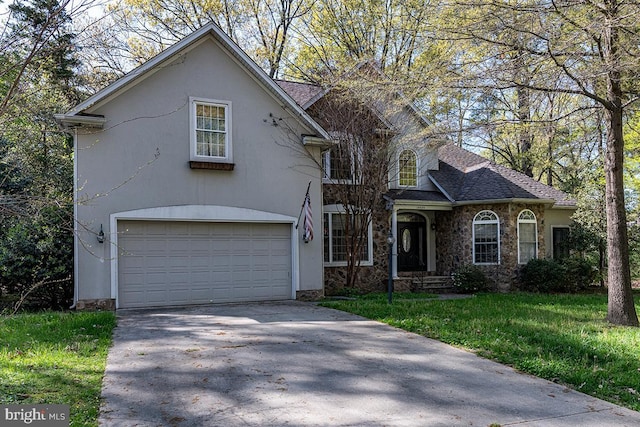 14535 Honeysuckle, Issue, MD 20645 - traditional-style home with a garage, stone siding, driveway, a front lawn, and stucco siding