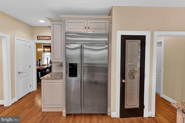 14535 Honeysuckle, Issue, MD 20645 - kitchen featuring built in fridge, light wood-style floors, a chandelier, baseboards, and recessed lighting