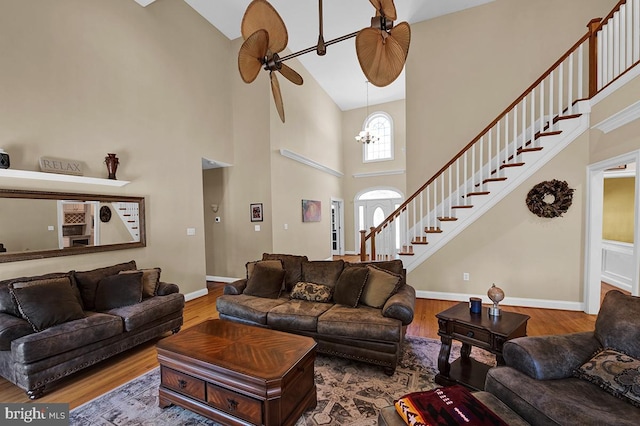 14535 Honeysuckle, Issue, MD 20645 - living area with high vaulted ceiling, wood finished floors, baseboards, stairway, and a ceiling fan