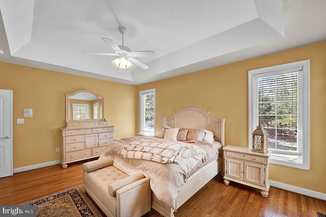 14535 Honeysuckle, Issue, MD 20645 - bedroom with a raised ceiling, wood finished floors, and baseboards