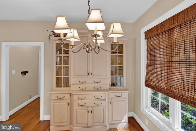14535 Honeysuckle, Issue, MD 20645 - detailed view of a chandelier, wood finished floors, and baseboards