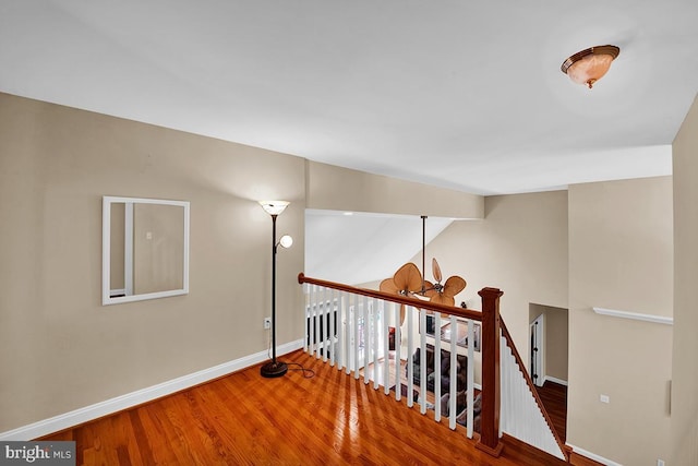 14535 Honeysuckle, Issue, MD 20645 - corridor featuring wood finished floors, an upstairs landing, baseboards, and lofted ceiling