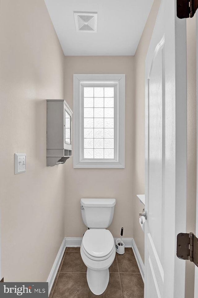 14535 Honeysuckle, Issue, MD 20645 - bathroom featuring baseboards, toilet, and tile patterned flooring