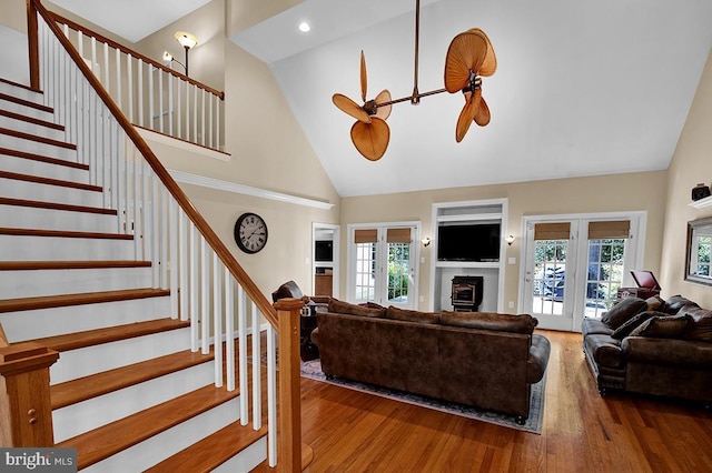 14535 Honeysuckle, Issue, MD 20645 - living room with high vaulted ceiling, stairway, wood finished floors, healthy amount of natural light, and french doors