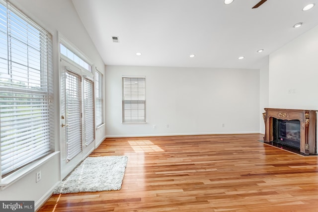 16453 Sparkling Brook Loop, Dumfries, VA 22025 - unfurnished living room featuring a fireplace with flush hearth, recessed lighting, light wood-style flooring, and ceiling fan