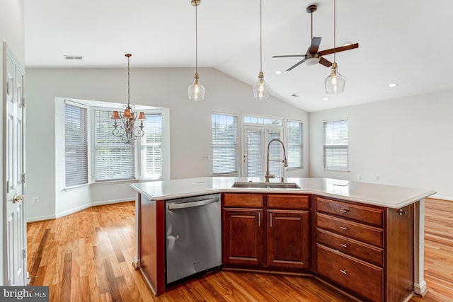 16453 Sparkling Brook Loop, Dumfries, VA 22025 - kitchen featuring dishwasher, light countertops, lofted ceiling, and light wood-type flooring