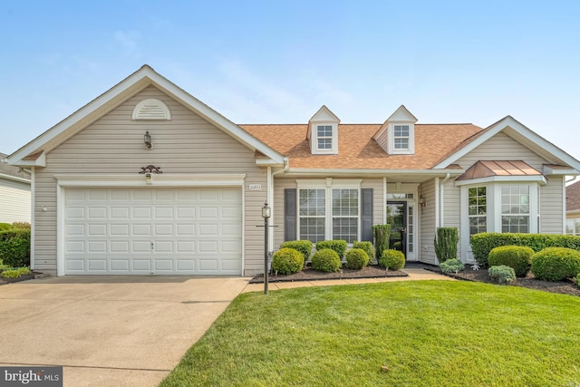 16453 Sparkling Brook Loop, Dumfries, VA 22025 - view of front facade with concrete driveway, a front lawn, roof with shingles, and a garage