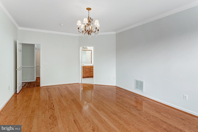 16453 Sparkling Brook Loop, Dumfries, VA 22025 - spare room with a chandelier, crown molding, and light wood-style floors