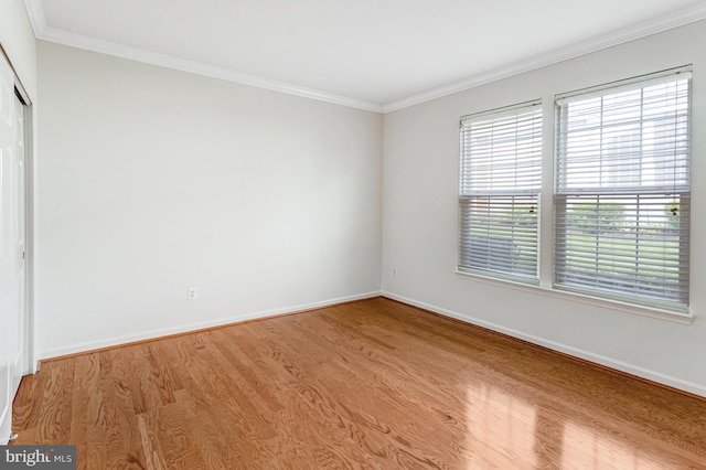 16453 Sparkling Brook Loop, Dumfries, VA 22025 - spare room with wood finished floors and ornamental molding